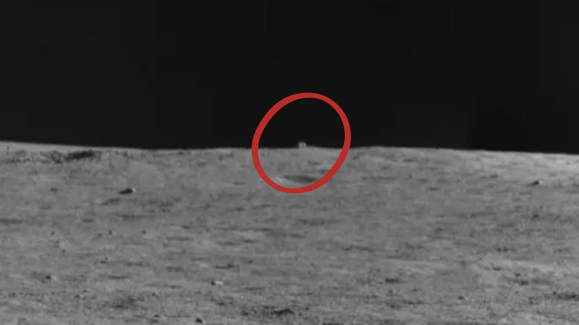  That distant, somewhat cube-shaped object is the "mystery house" China's Yutu-2 rover is planning to take a closer look at.  Photo by CNSA