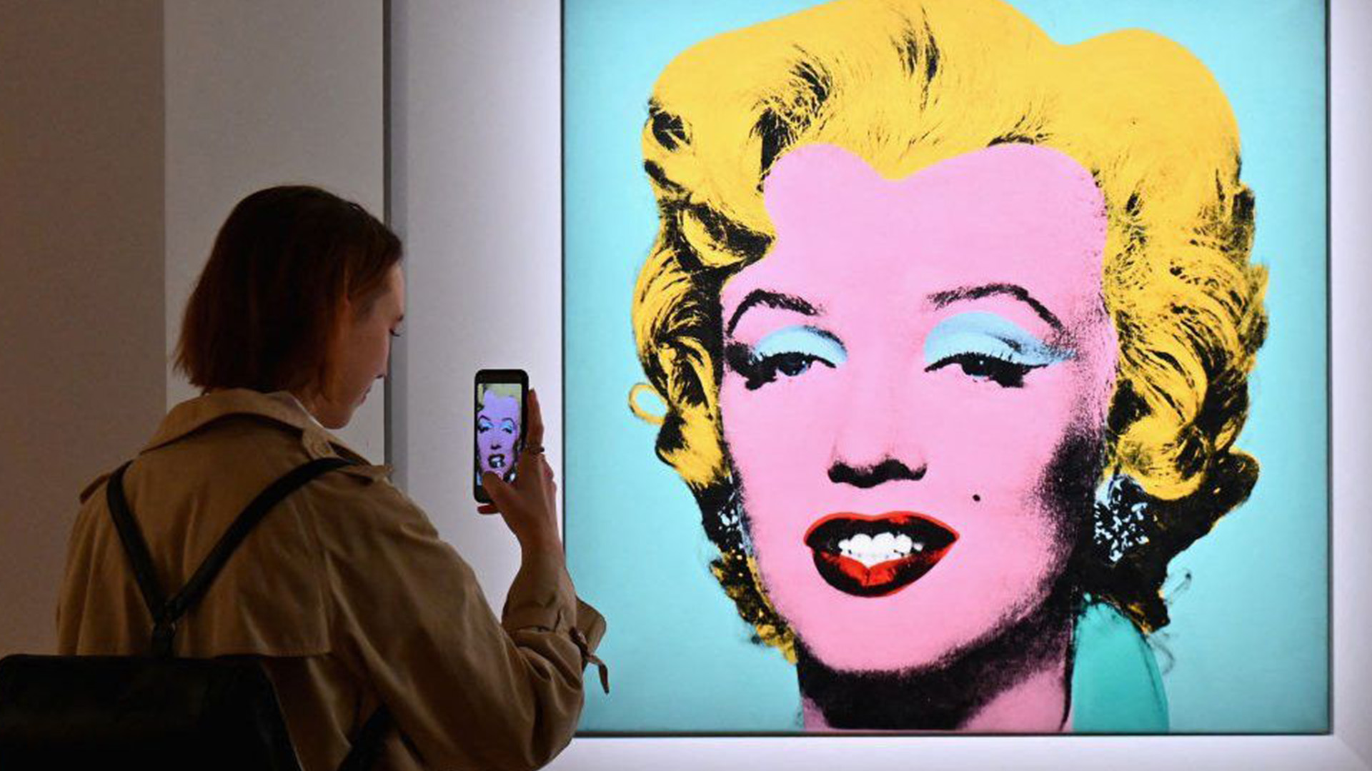 Andy Warhol's "Shot Sage Blue Marilyn" at an auction preview in April - Photo Credit: BBC