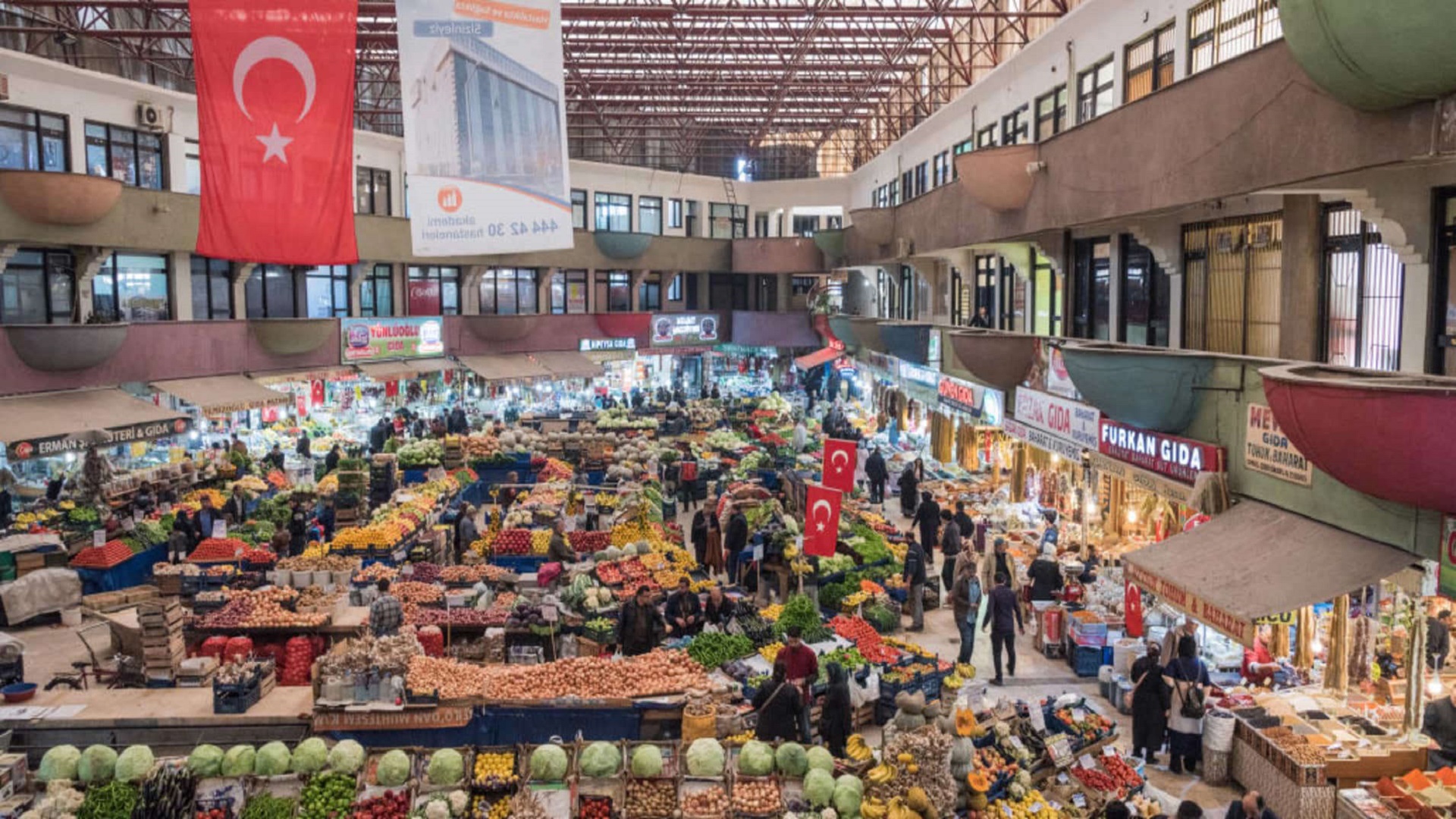 Shoppers stroll the aisles of a bazaar in Konya, Turkey. The country is experiencing brutal inflation, with food and non-alcoholic beverage prices rising 70.3% year over year for March.