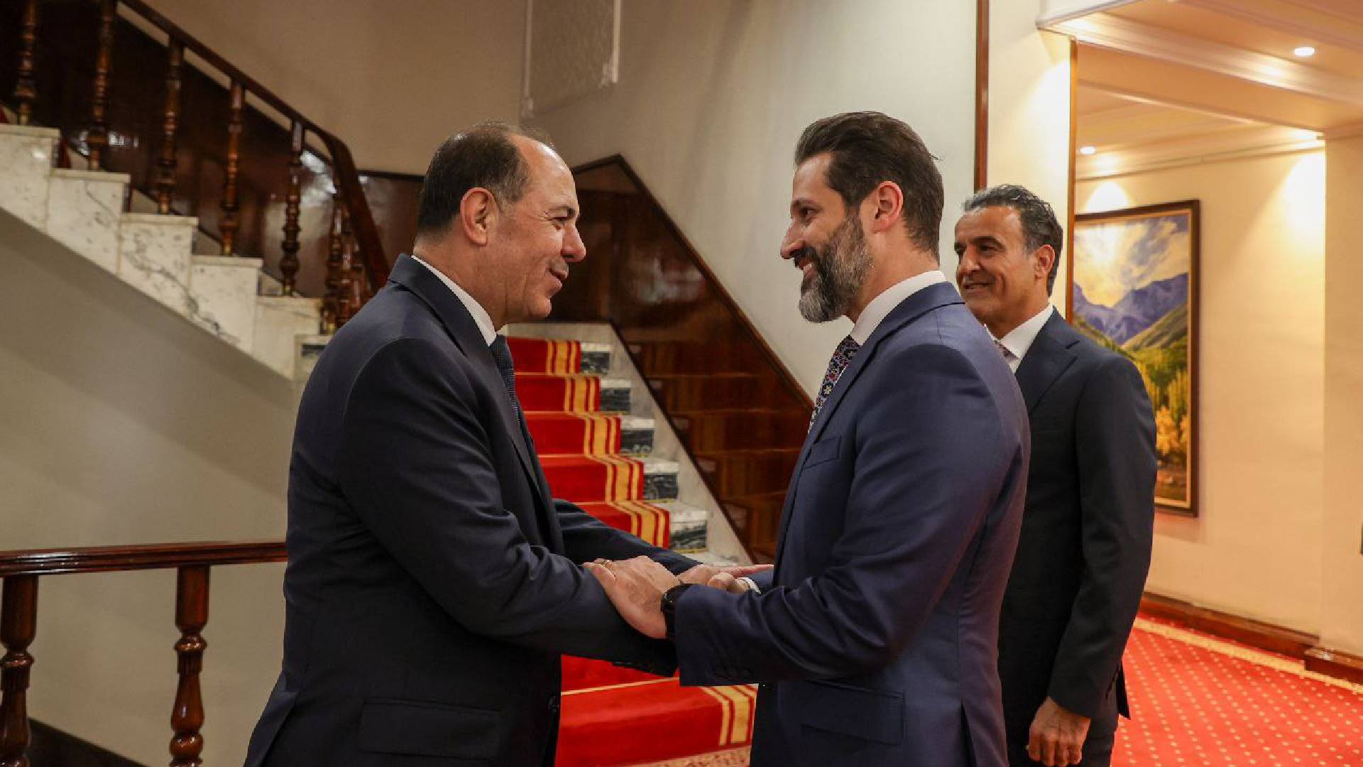  Kurdistan Region's Deputy PM Qubad Talabani greeting Dr. Mamoun Al-Debi'e.