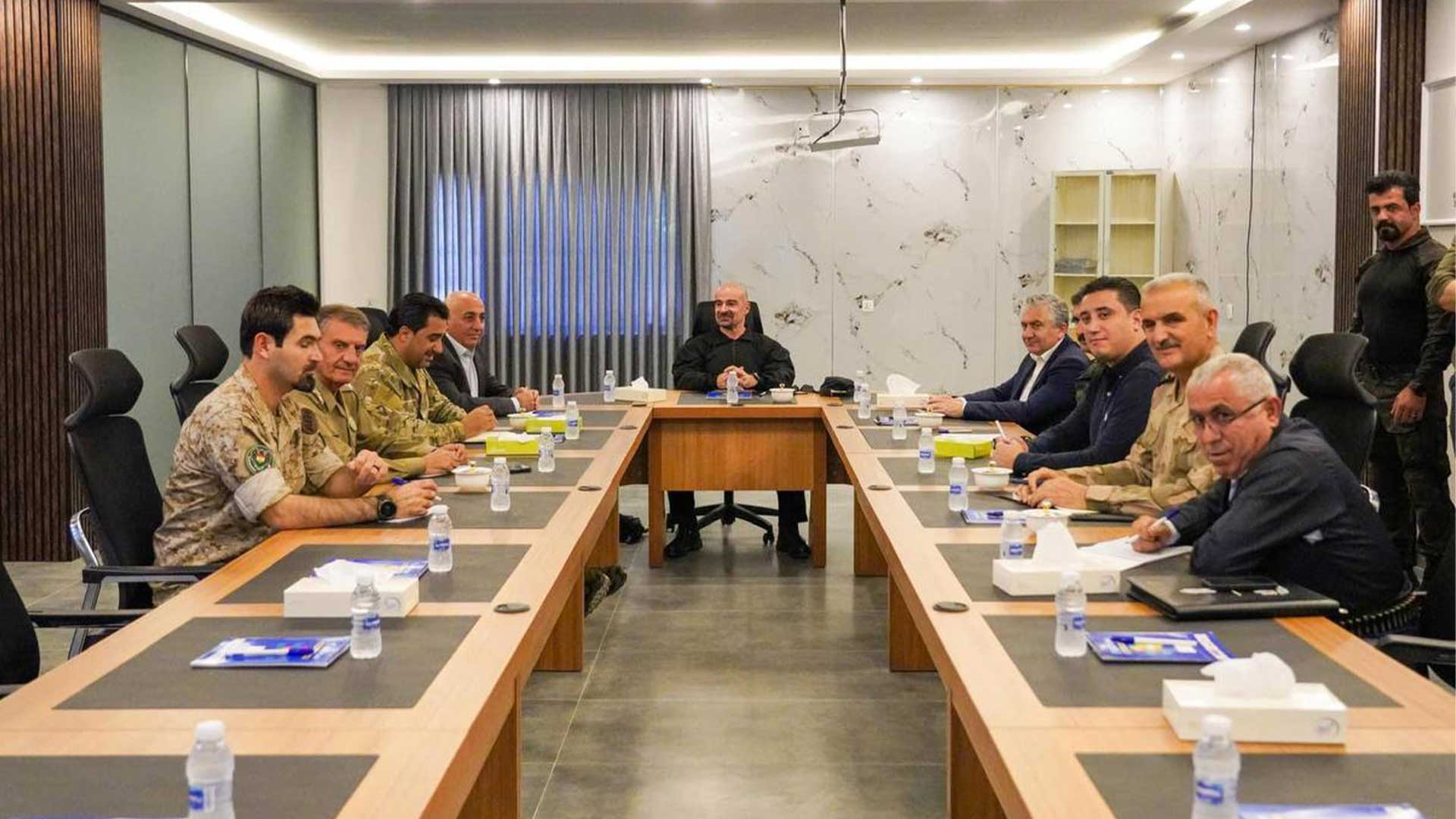  PUK President Bafel Jalal Talabani among security officers.