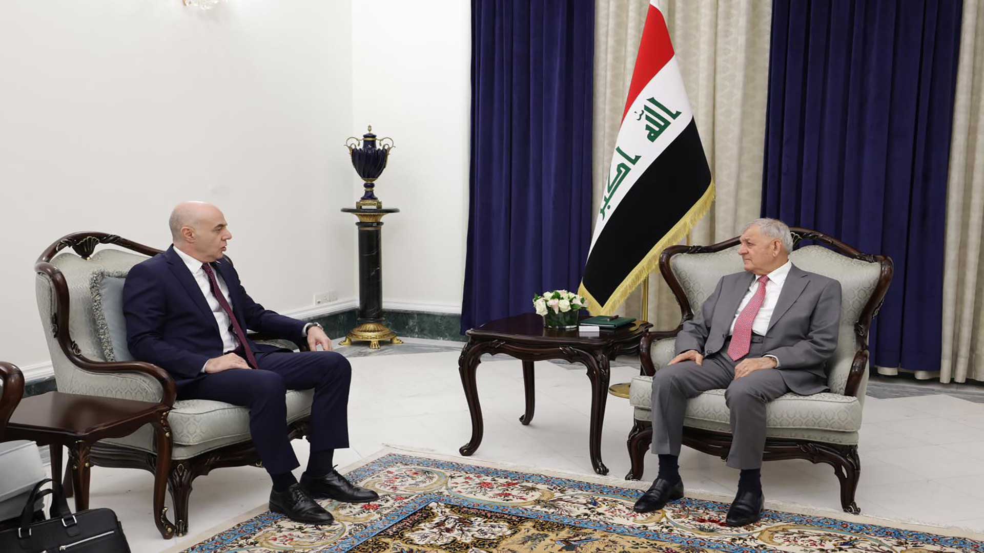  Iraqi President Abdullatif Jamal Rashid on the right and Turkish Ambassador Ali Reza Guney on the left.